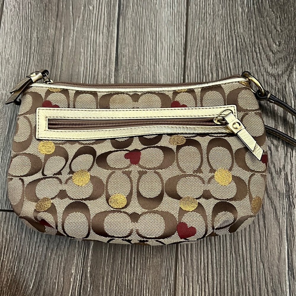 Lightly worn coach crossbody with hearts